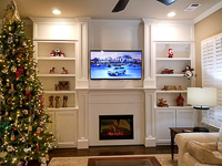 White Custom Entertainment Center Cabinets and Fireplace Surround in Robson Ranch Texas