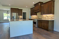 Stained Red Oak Custom Kitchen Cabinets White Island in Valley View Texas