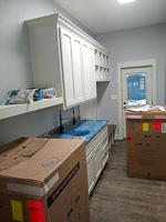 white custom laundry and mud room cabinets in Valley View Texas