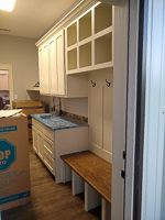 white custom laundry and mud room cabinets in Valley View Texas