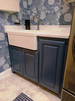 dark blue custom laundry room base cabinet with farm sink in Allen Texas