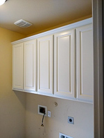 white custom laundry room cabinets in McKinney Texas