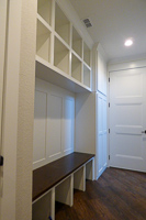 white custom laundry and mud room cabinets in Valley View Texas
