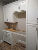 white custom laundry room cabinets in Denton Texas