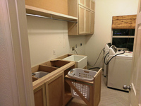 paint grade custom laundry room cabinets in Frisco Texas