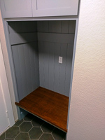 light blue custom mud room cabinet with stained bench seat in Denton Texas